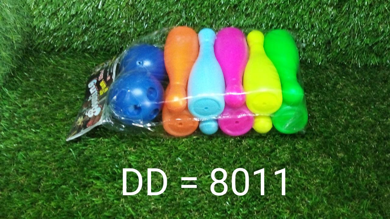 Bowling pins and balls perfectly arranged, ready for the next round of fun and skill development.