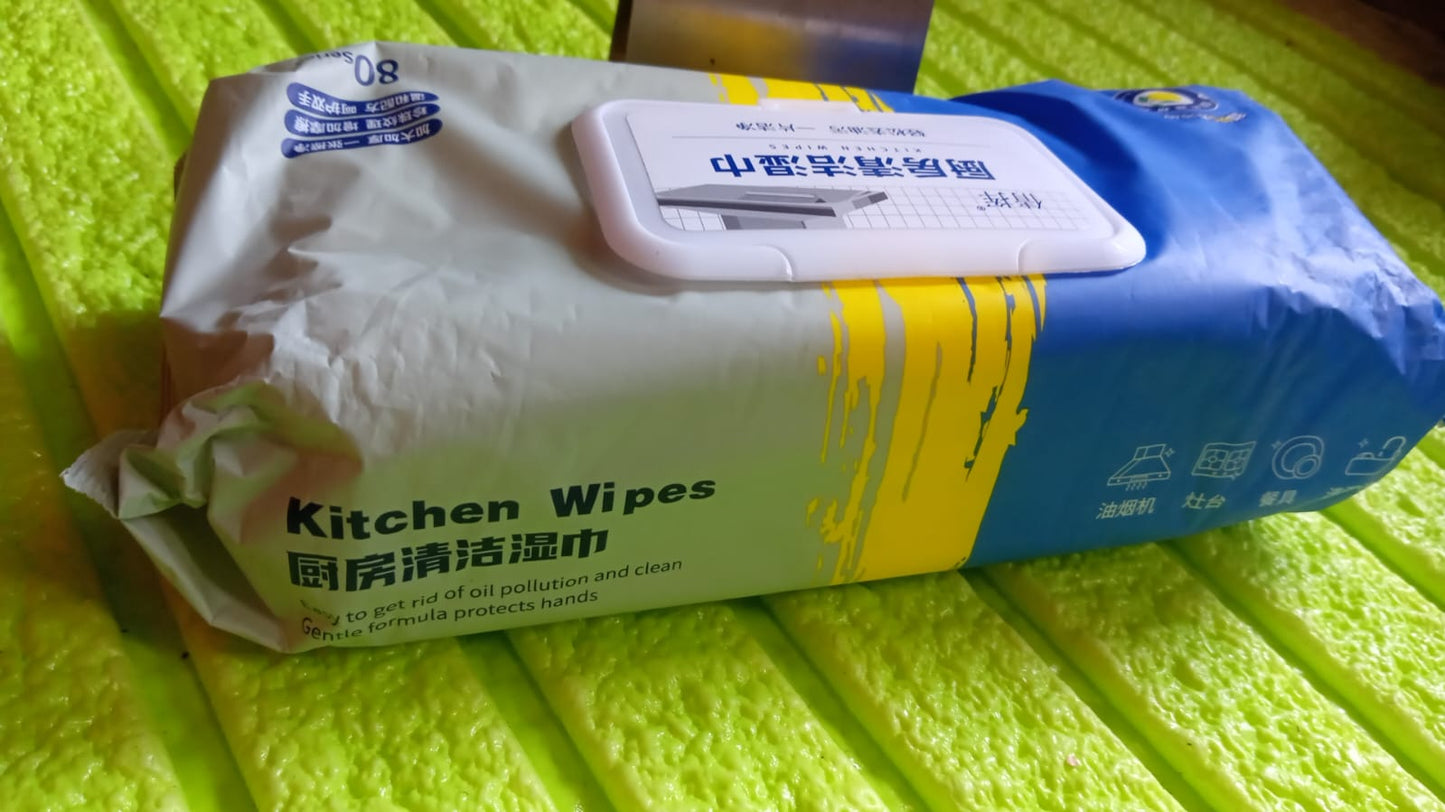 Velvet Wipe cleaning a greasy kitchen cooktop, demonstrating effective grime removal.