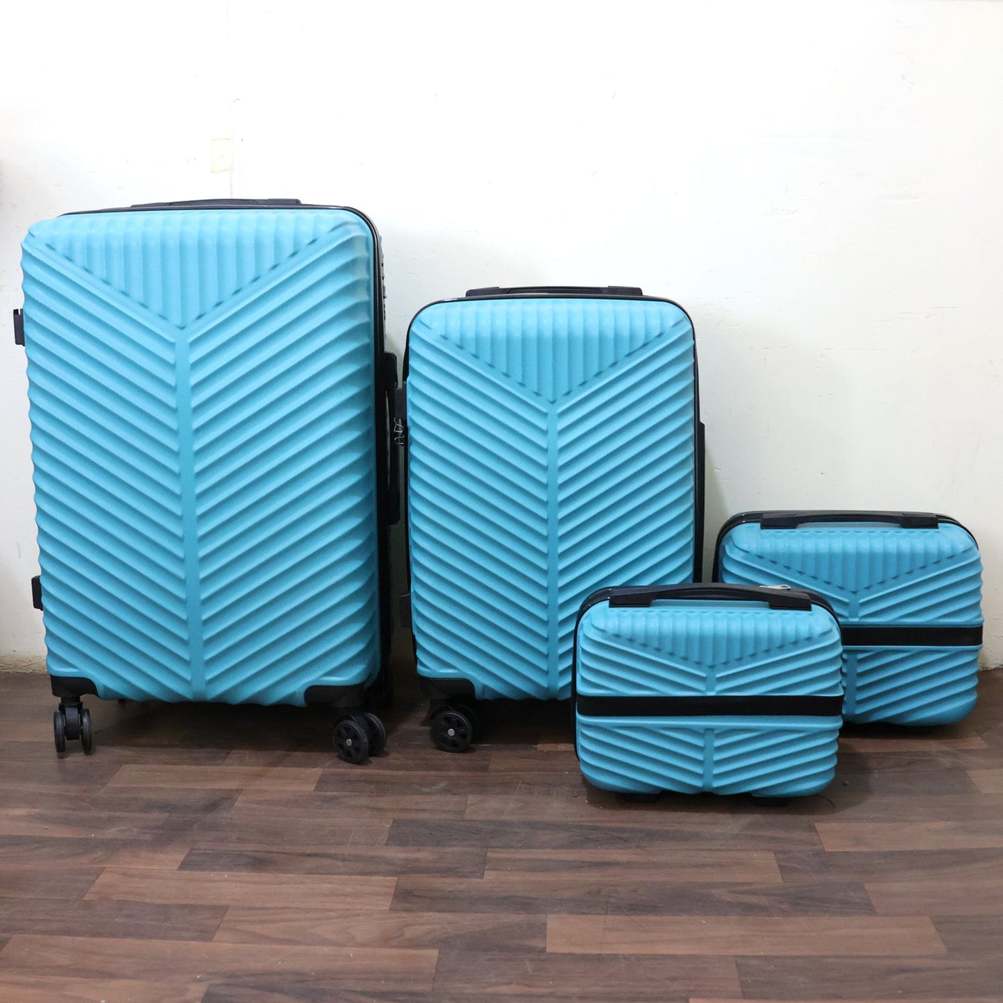 Close-up of suitcase with handle and wheels from the 4-in-1 luggage collection
