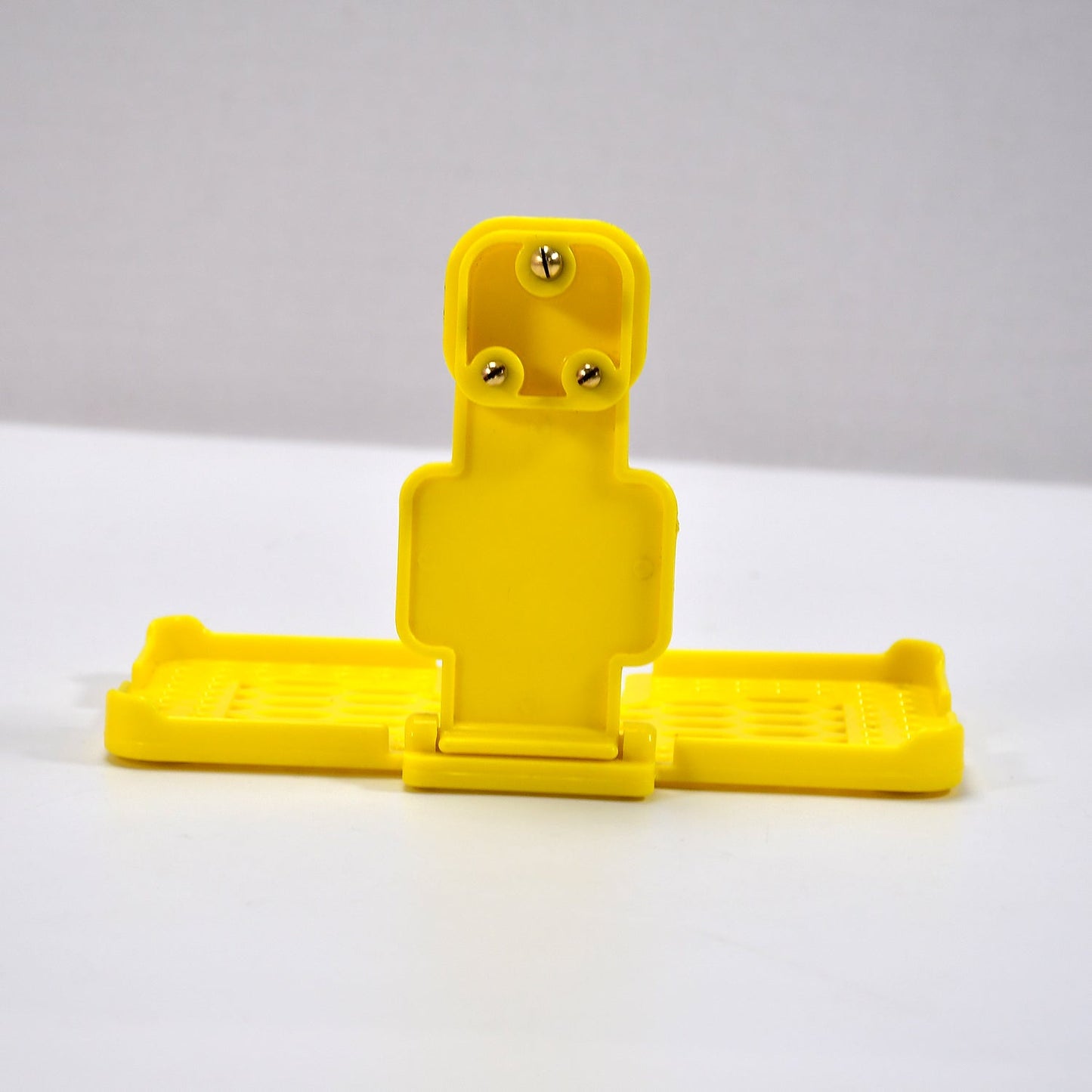 Back view of the PHOBIA yellow mobile charging wall holder, ready for installation.