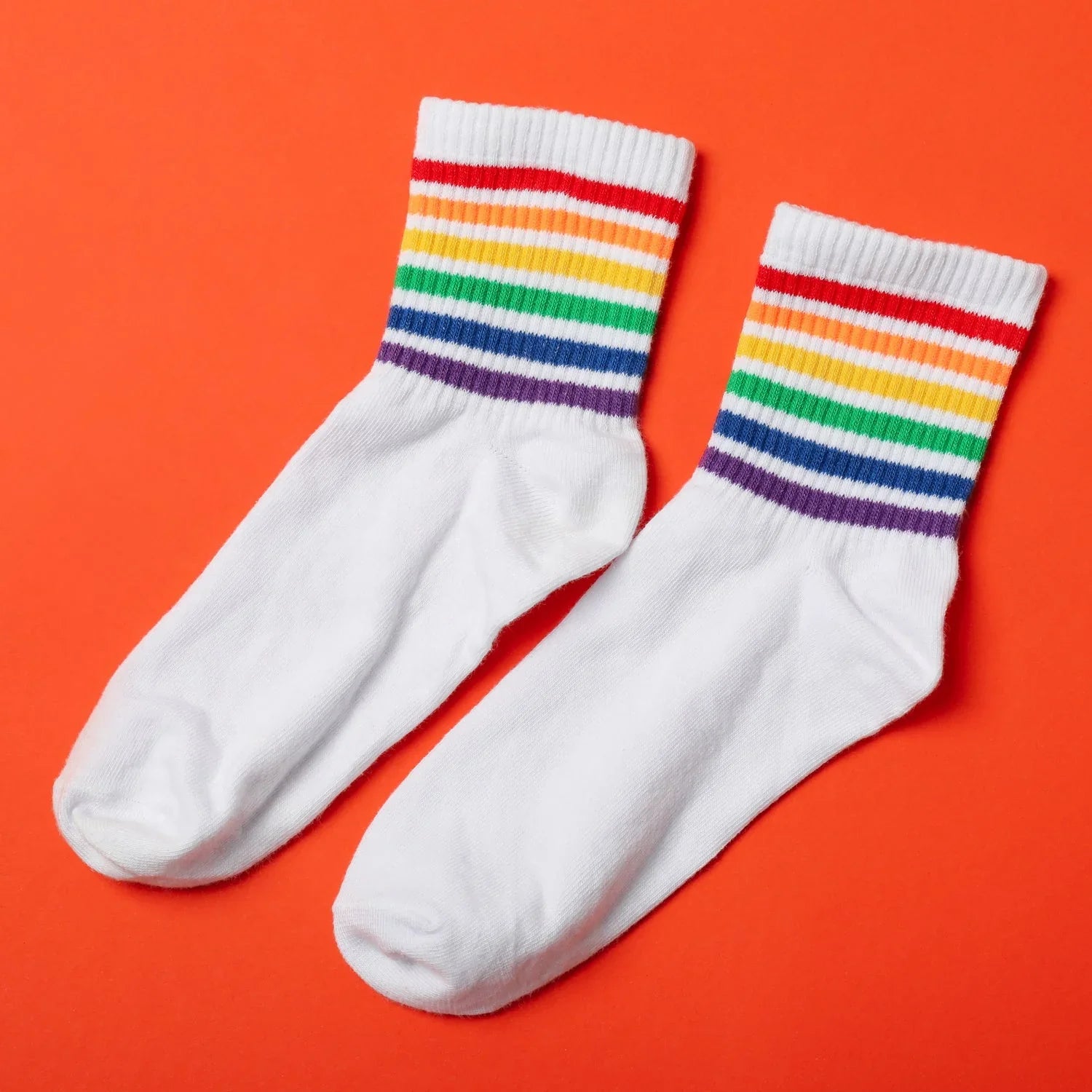 A vibrant assortment of Printed Designer Socks showcasing various patterns and colors.