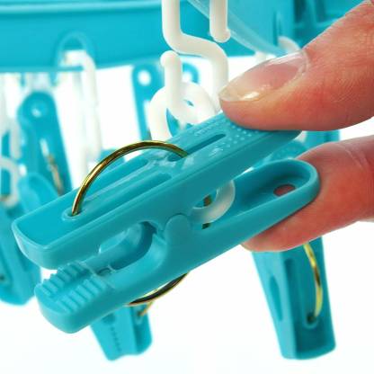 360-degree rotatable round plastic cloth drying hanger with 24 clips.