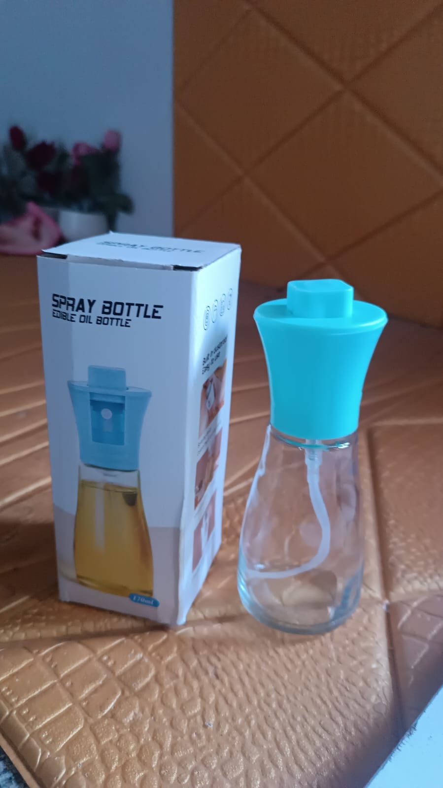 Vertical close-up shot of the elegant oil dispenser bottle, emphasizing its design.