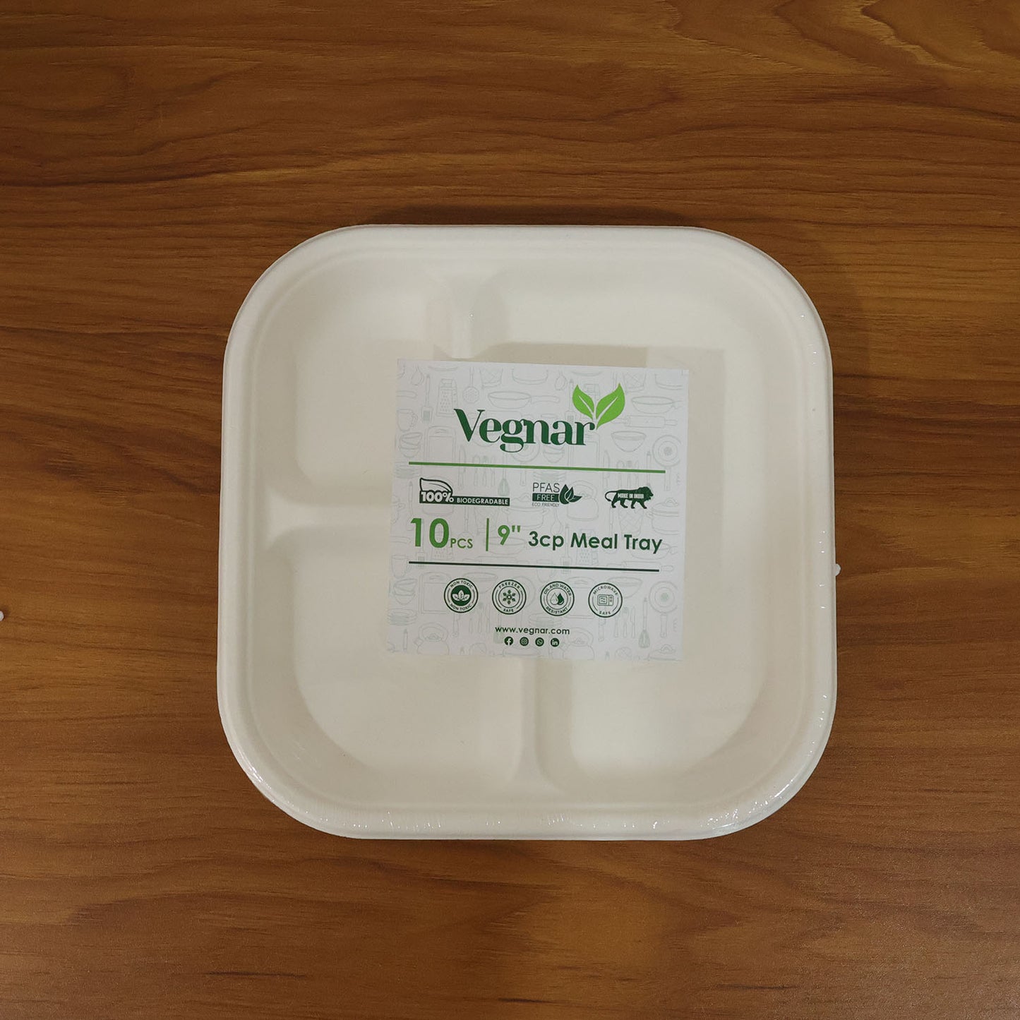 Live use of sturdy compostable bagasse plate with separate meal compartments