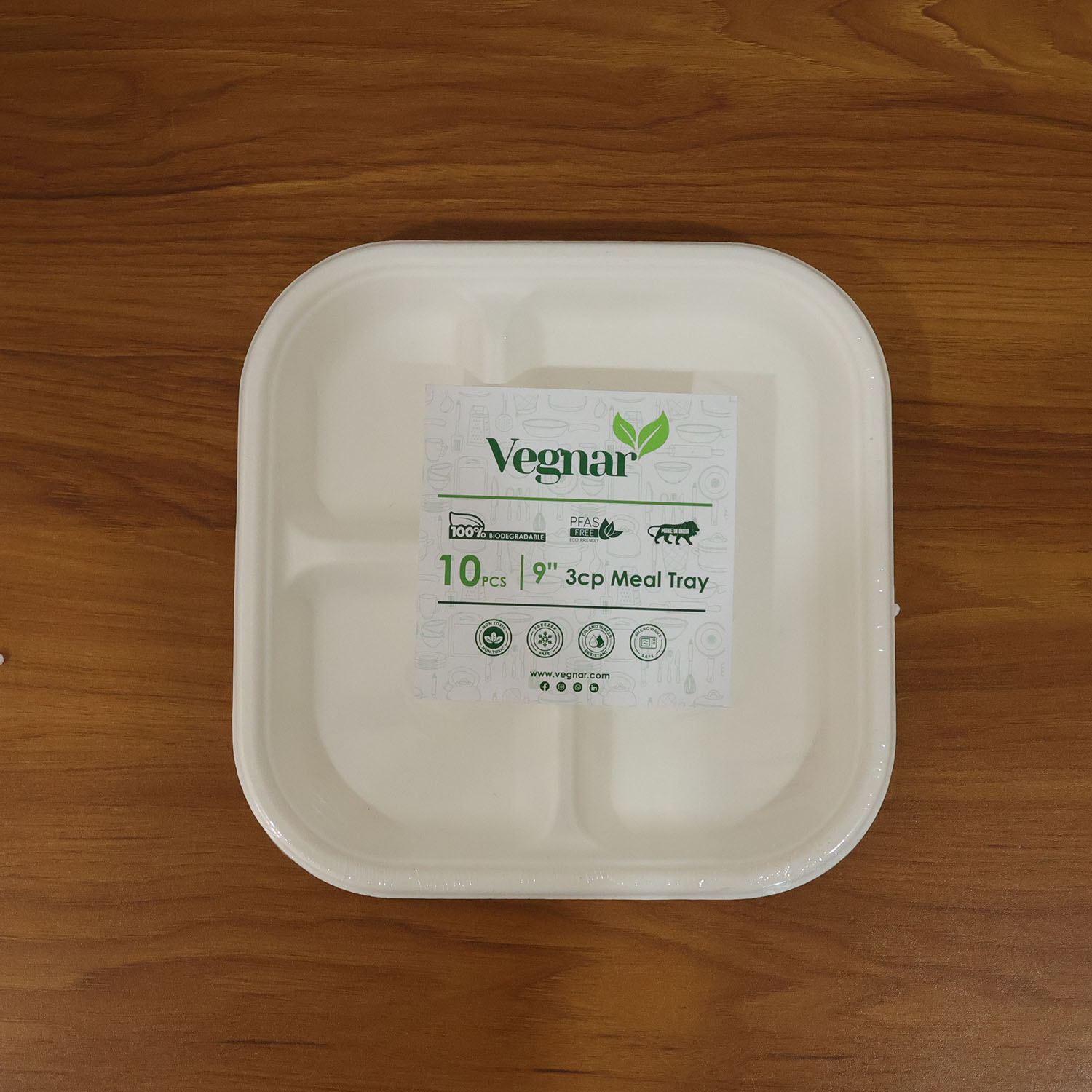 Live use of sturdy compostable bagasse plate with separate meal compartments