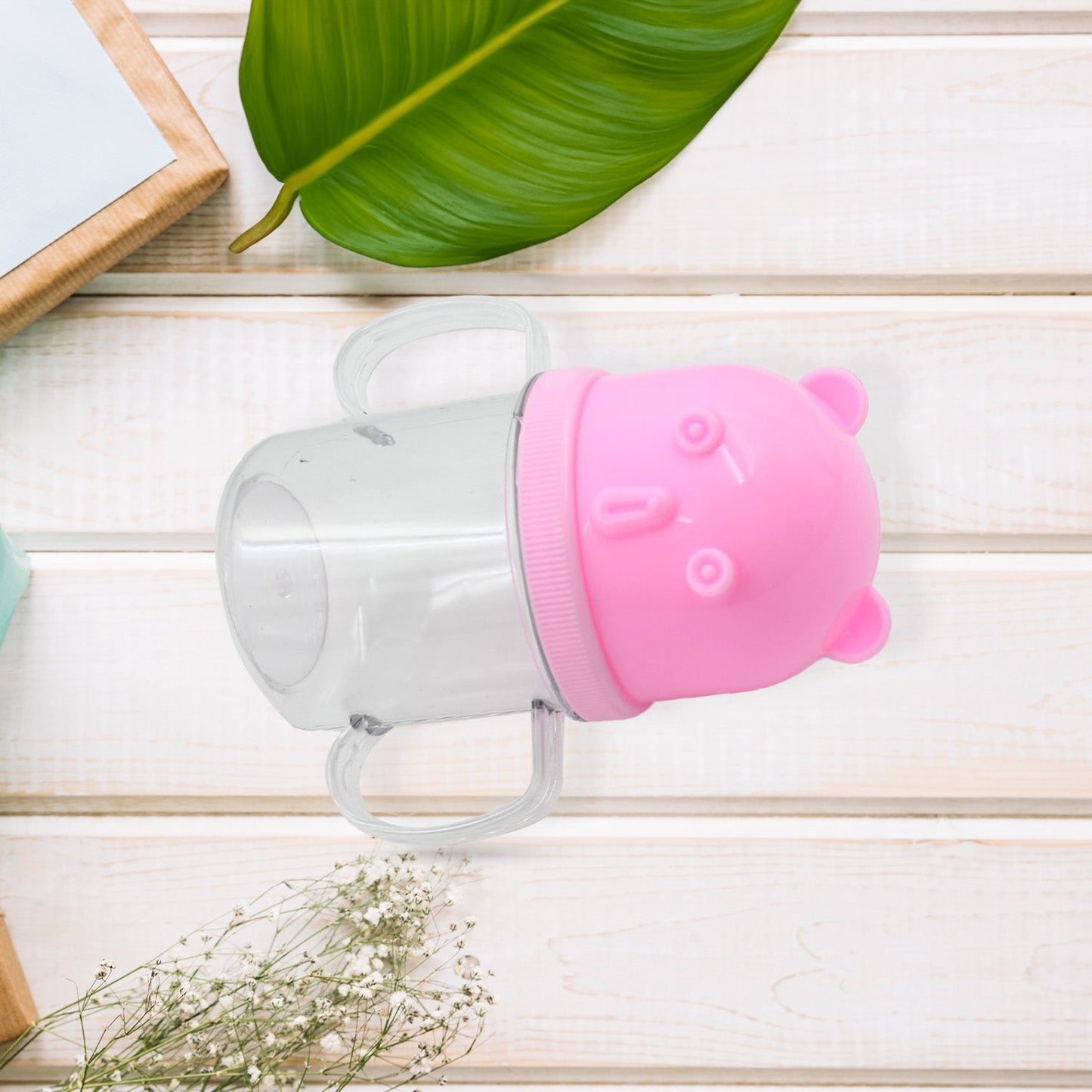 A vibrant baby milk mug, 250 ml, showcasing its lightweight and safe construction.