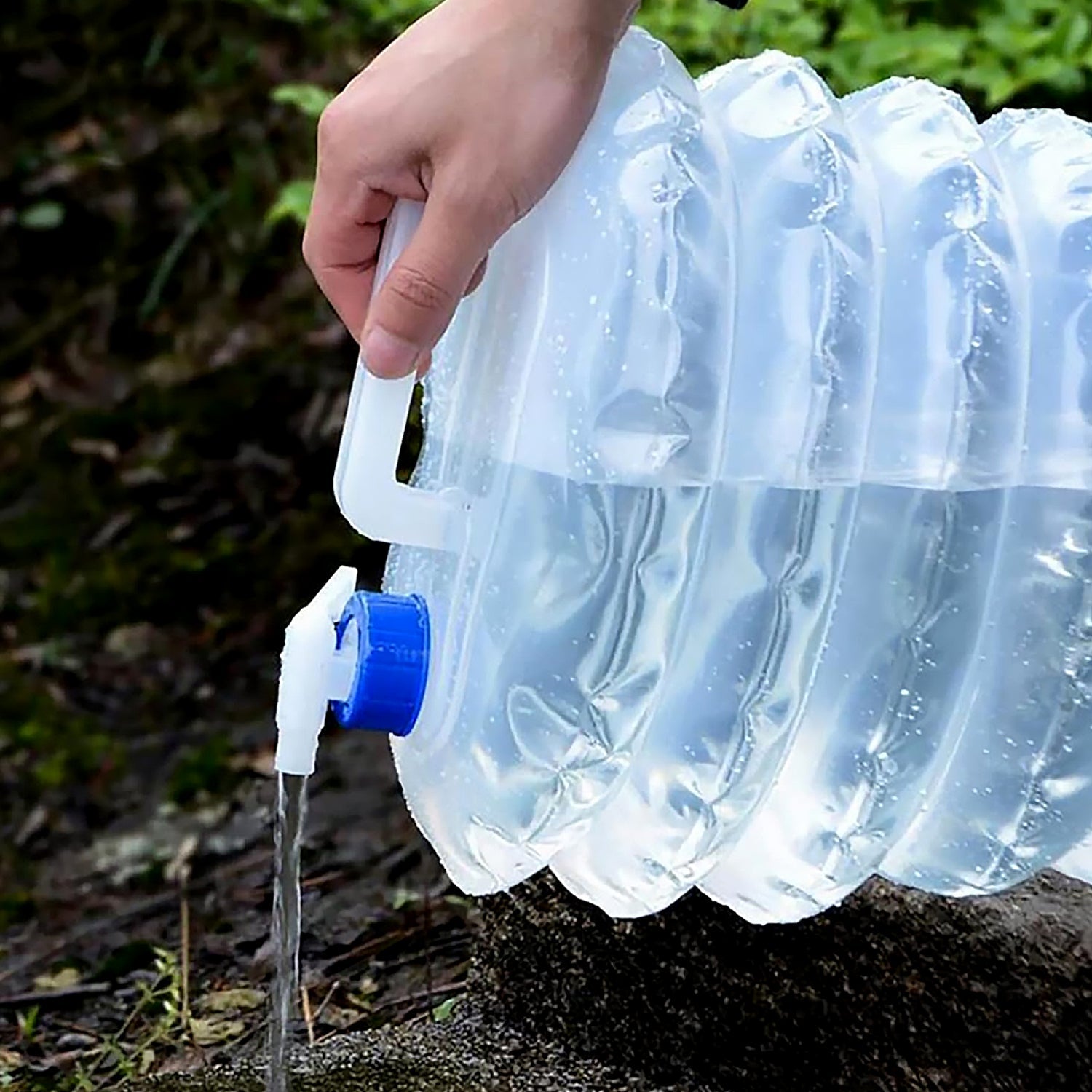 Close-up view of the ON/OFF tap valve on the collapsible water container.