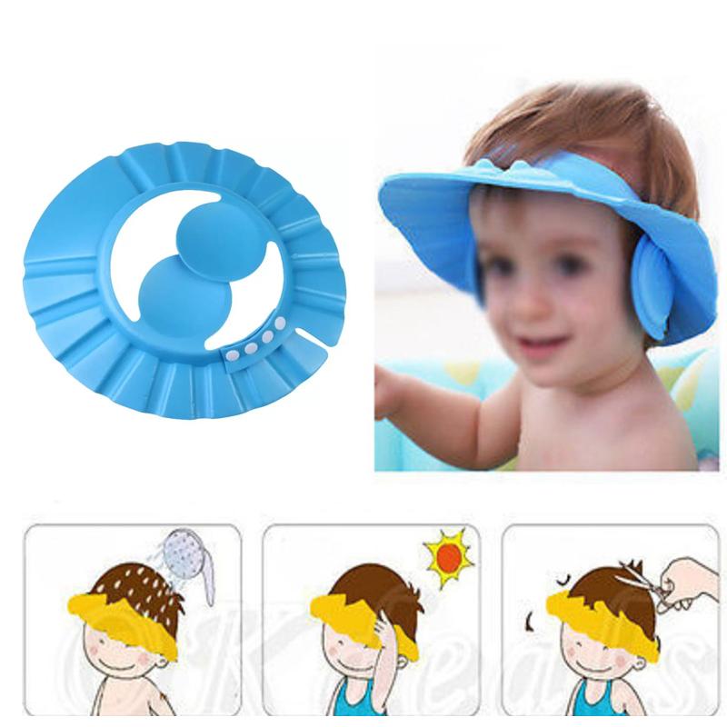 Child wearing a soft, pink baby shower cap, protecting eyes from water.