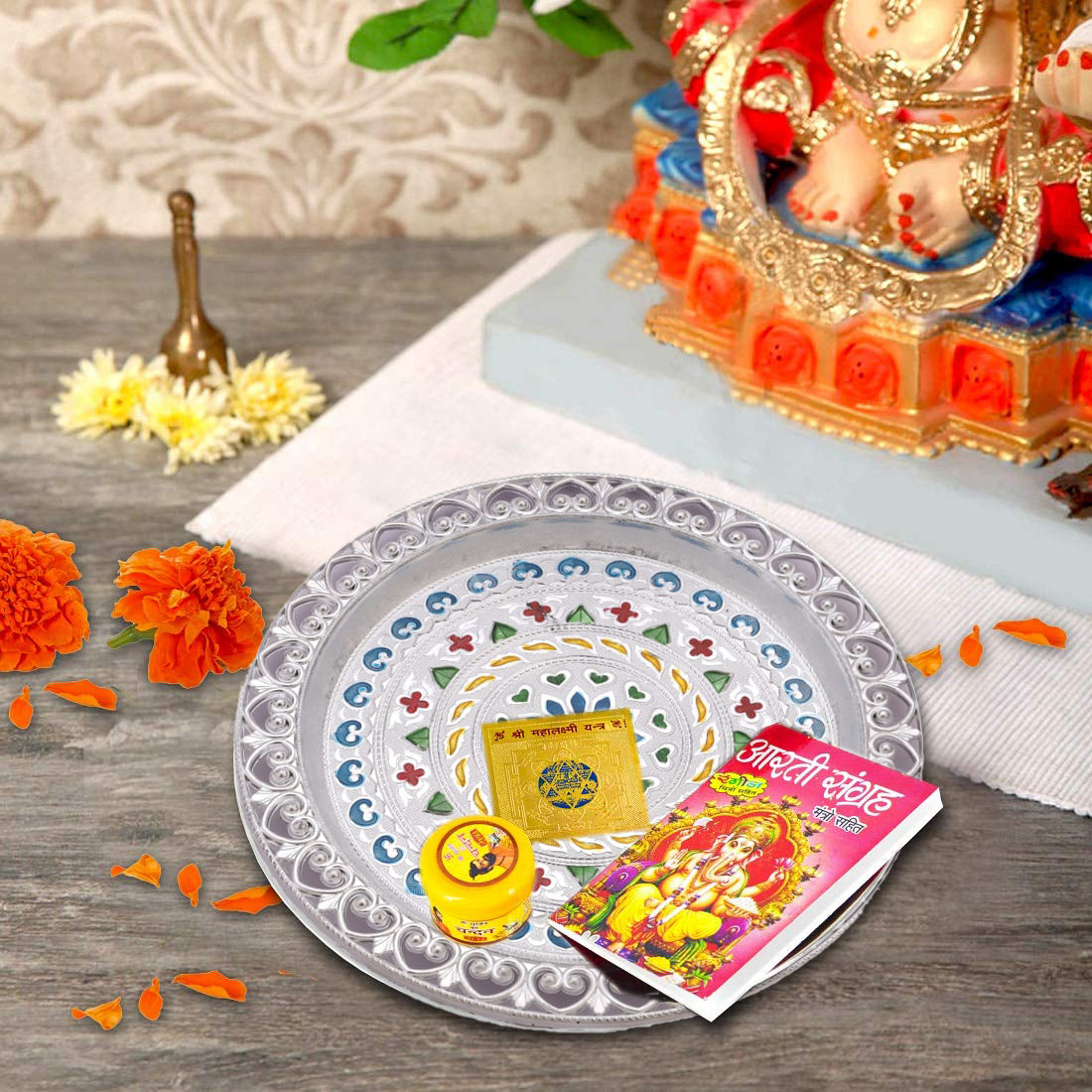 Close-up view of the intricate detailing on the silver plated pooja thali.