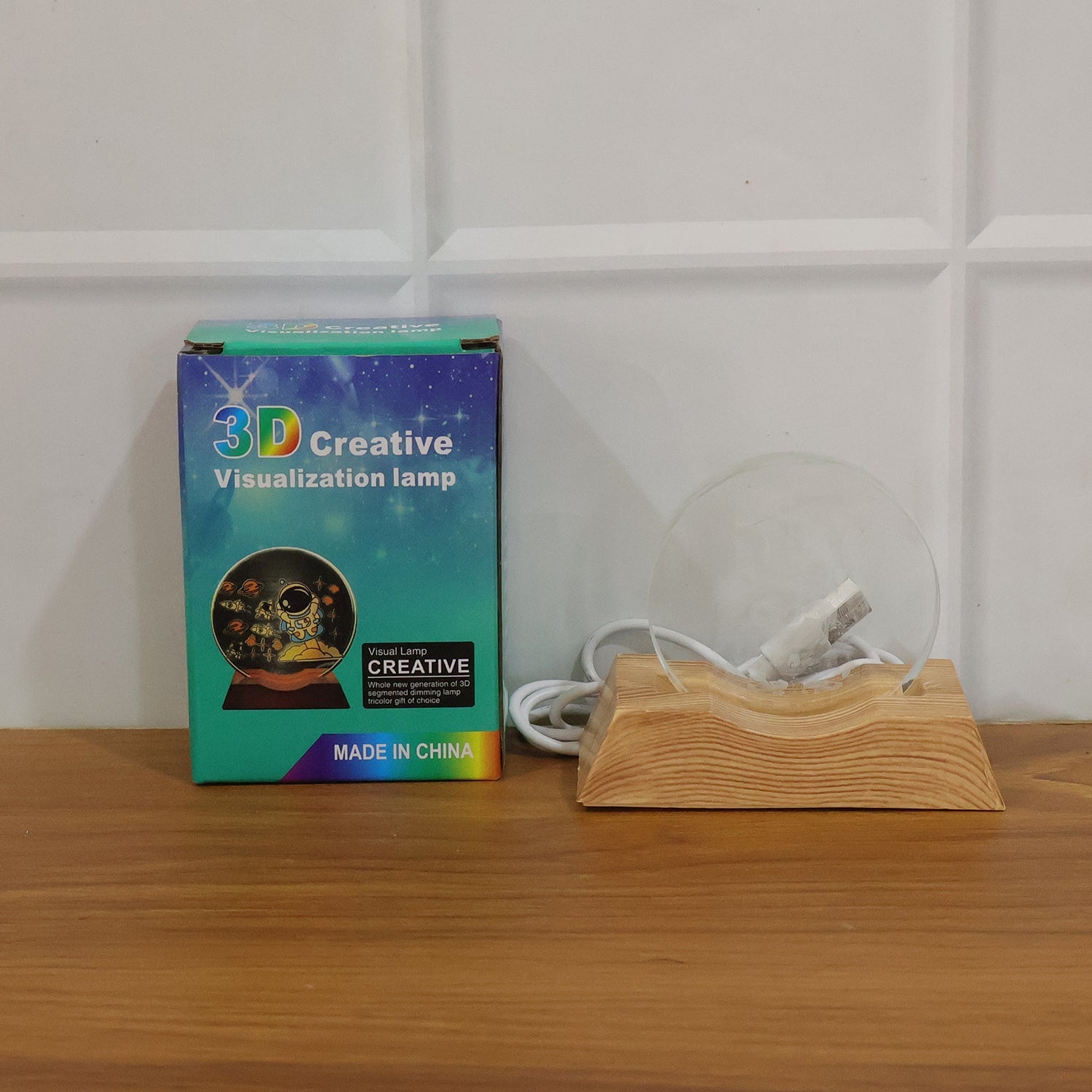 3D Lord Ganesha LED night lamp placed on a decorated home desk