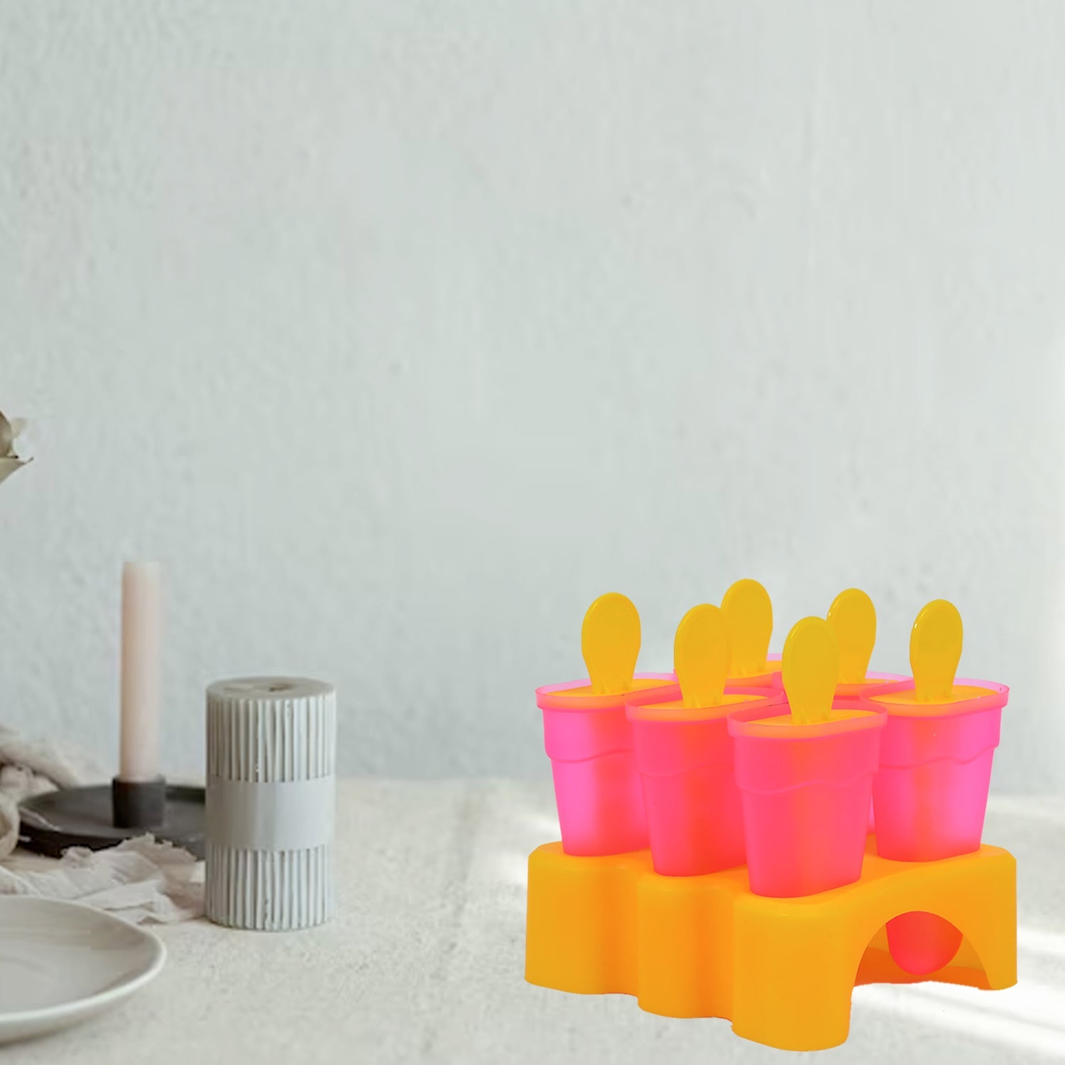 Kulfi moulds with their lids on, ready to be placed in the freezer.