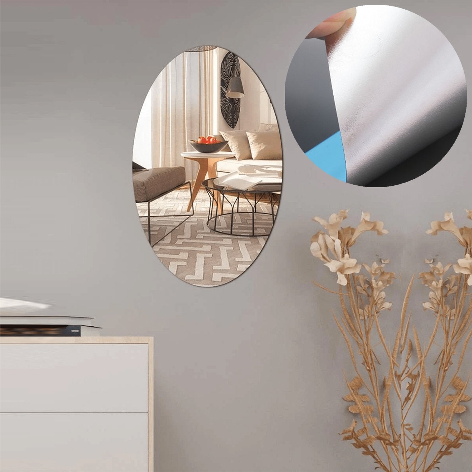 Two oval adhesive bathroom mirror stickers arranged decoratively on a wall.