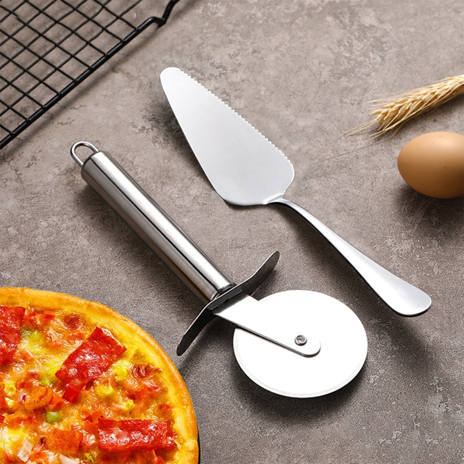 Sharp stainless steel pizza cutter blade with a finger guard.