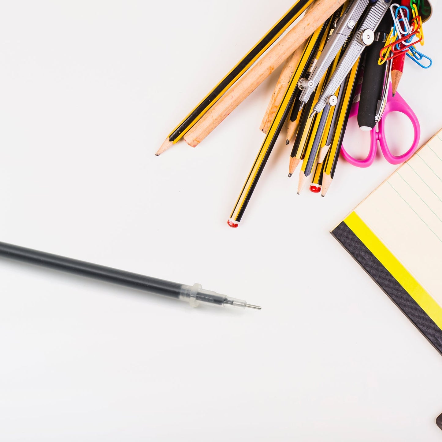 A single black pen refill with a metal tip, ready for use.