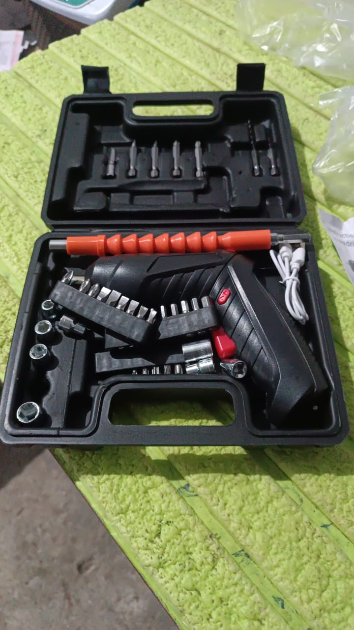 Lifestyle shot of the Cordless Electric Screwdriver being used for a home repair task.
