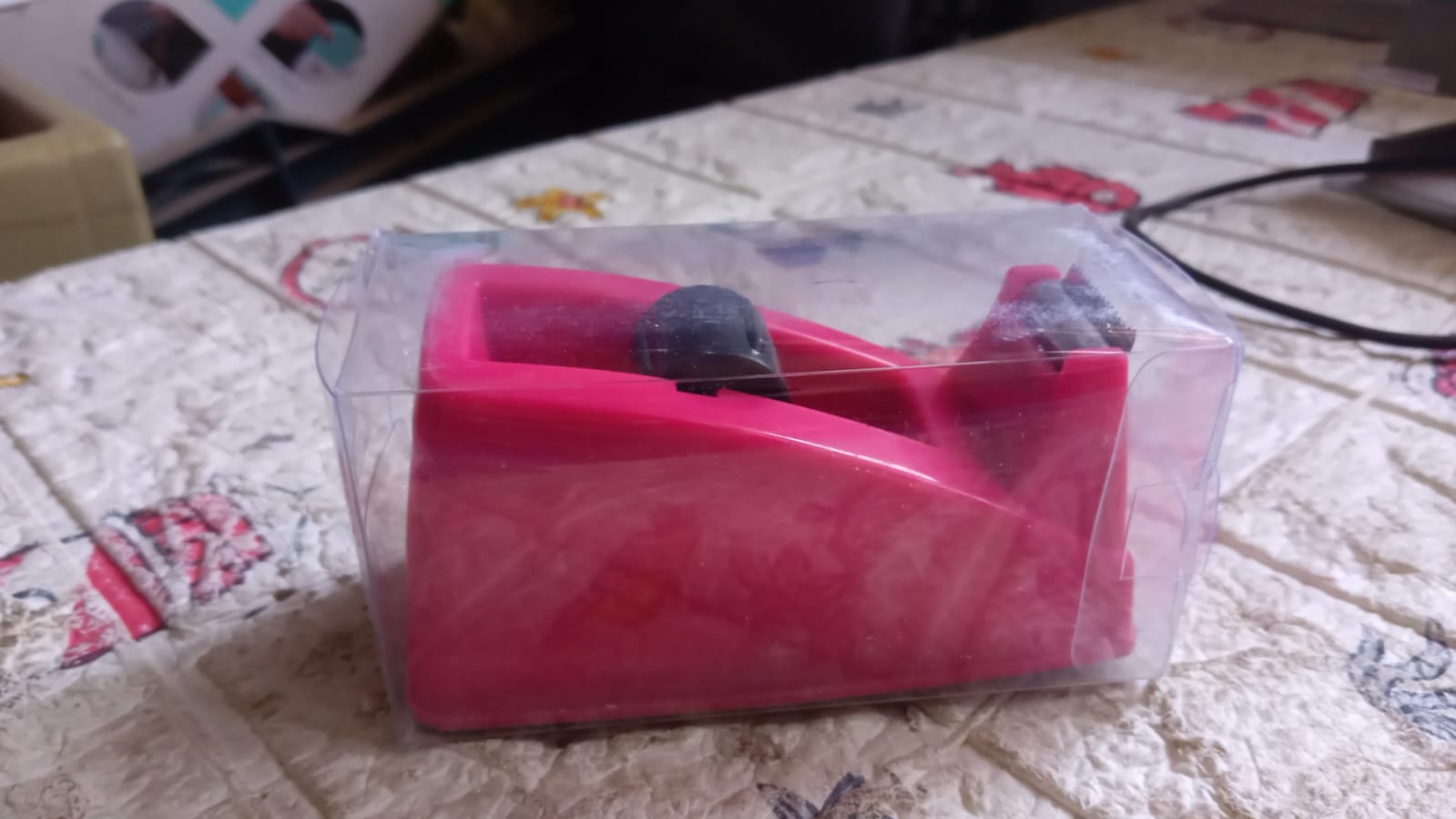 Plastic tape dispenser ready for packaging tasks