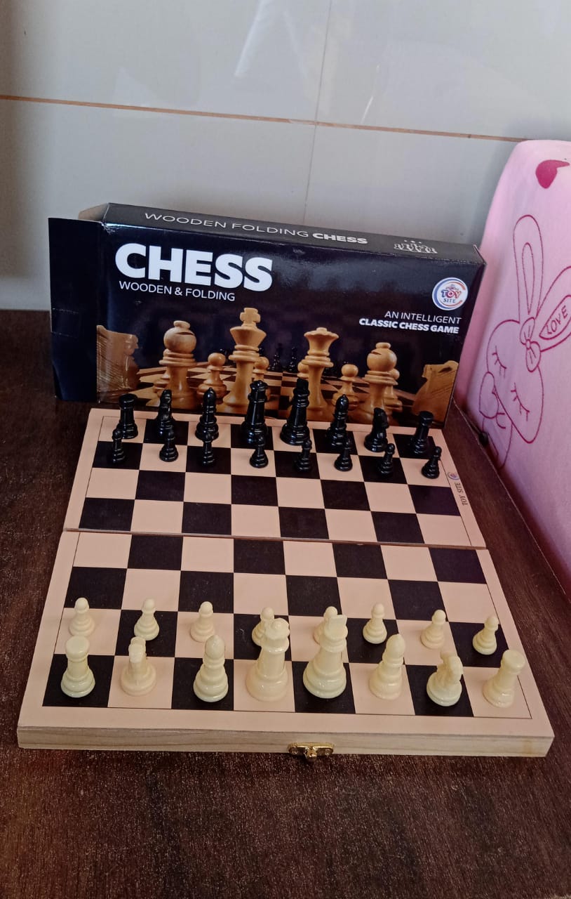 Lifestyle shot featuring the folding wooden chess set, perfect for family game nights.