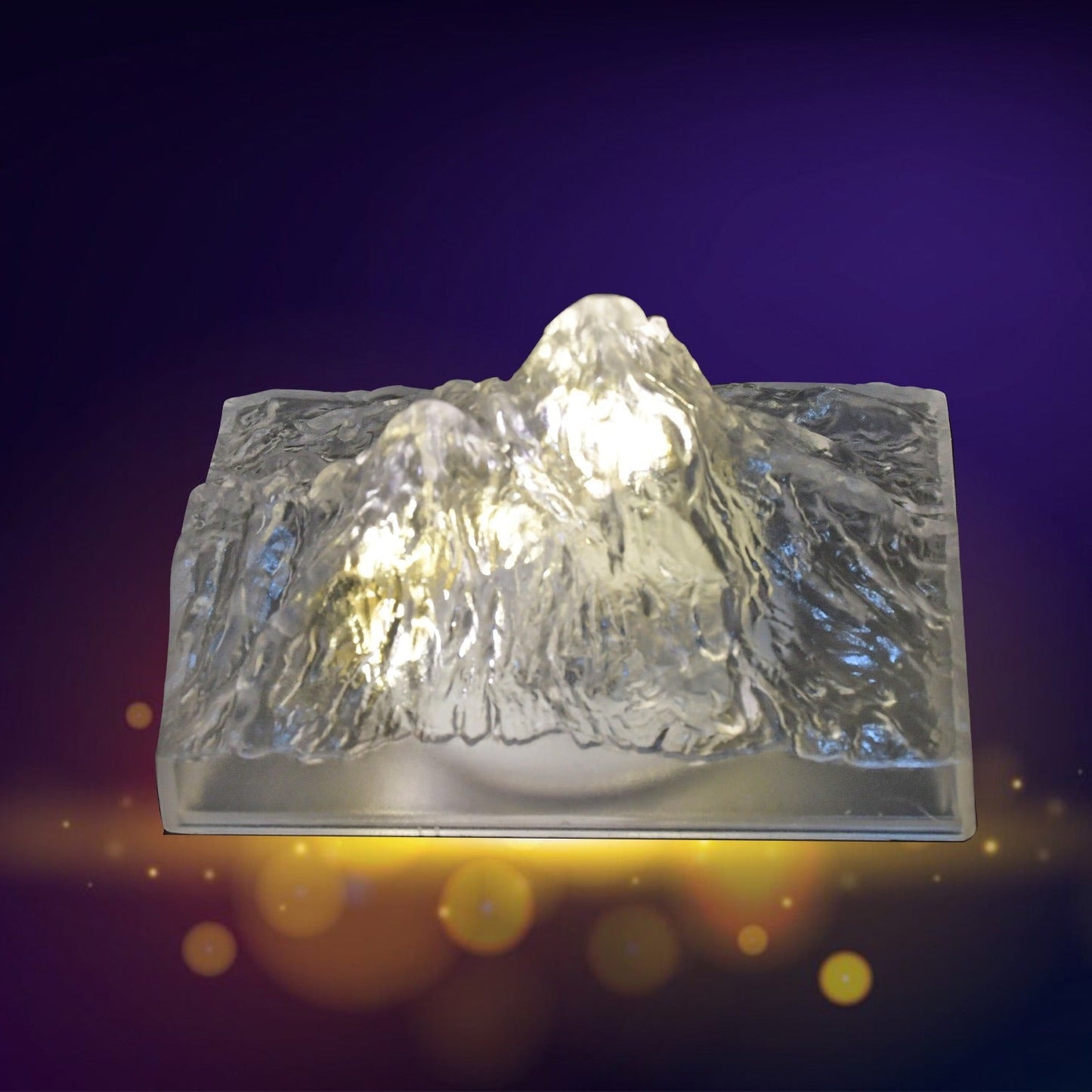 A hand demonstrating the simple one-touch control of the Iceberg Night Light.