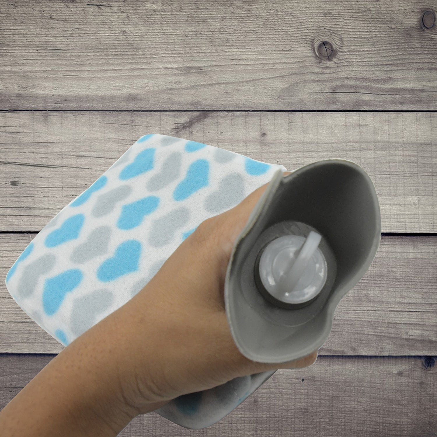 Front view of the hot water bag with its protective fabric cover.