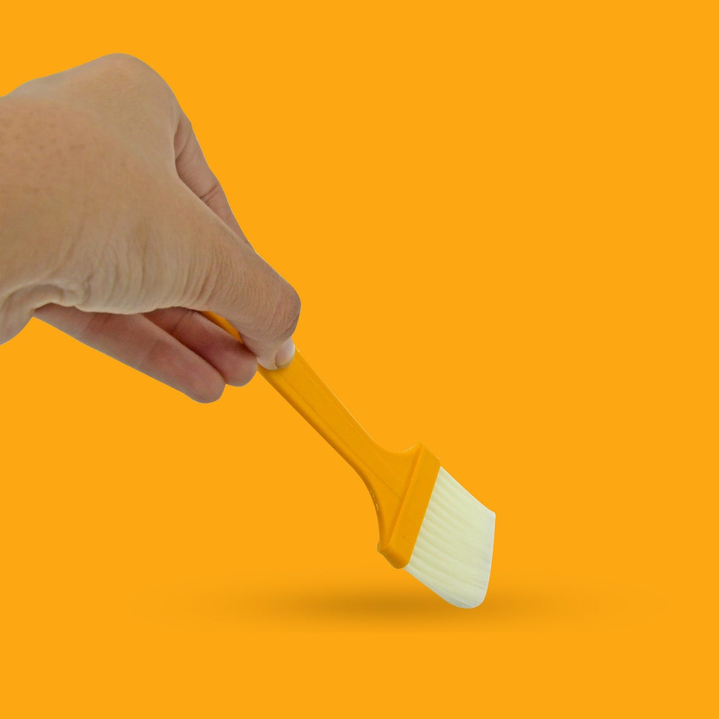 Versatile silicone brush for BBQ, baking, and general cooking.