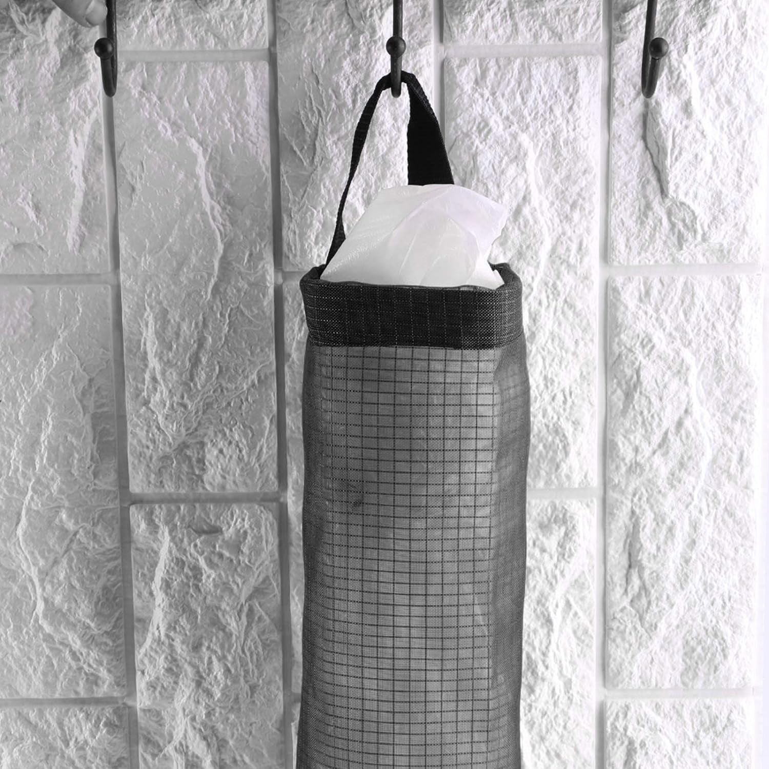 Back view of the waste bag holder, showing the wide handle for easy hanging on a hook.