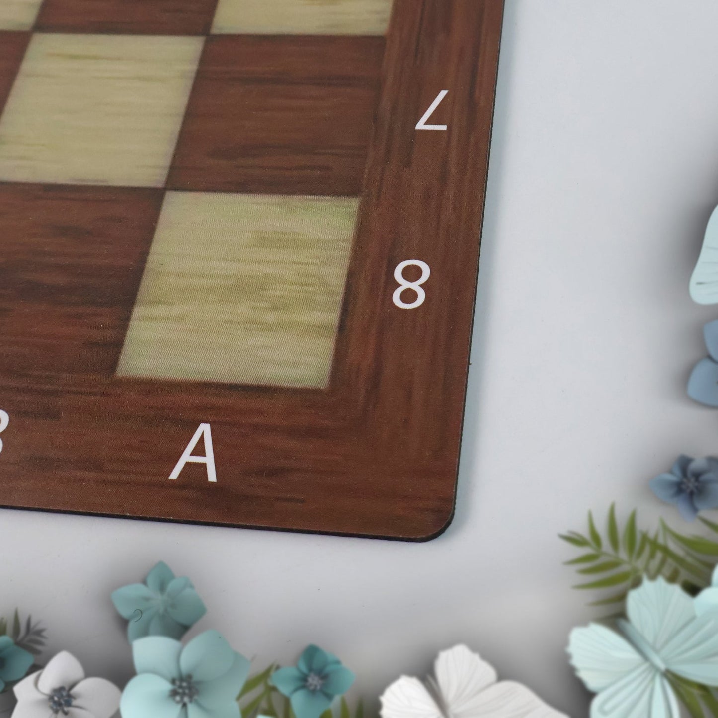 Close-up view of plastic chess pieces from Chess & Checkers travel set