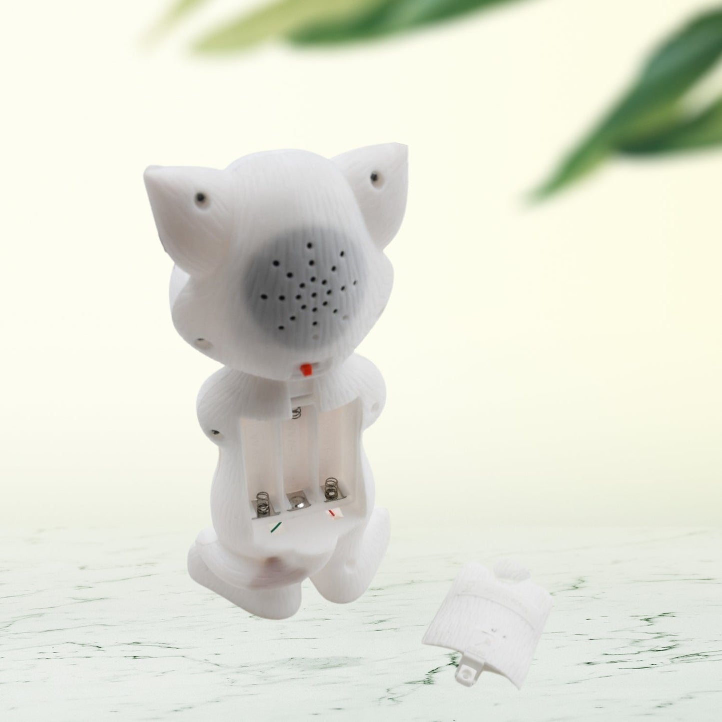 Talking Tom Toy on a clean background, emphasizing its mimicry function for language development.
