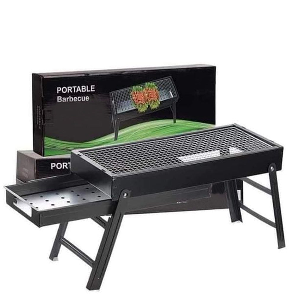 FirePot portable charcoal BBQ grill unfolded and ready for use outdoors.