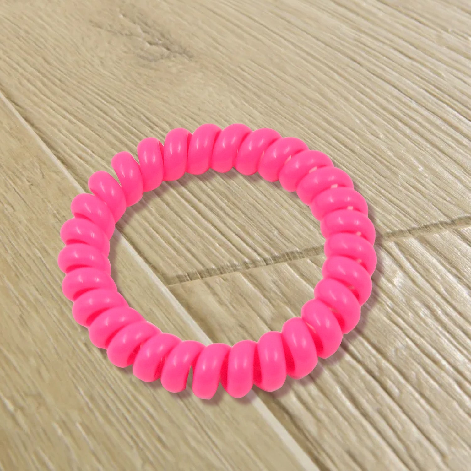 Assorted colors of durable telephone wire hair ties.