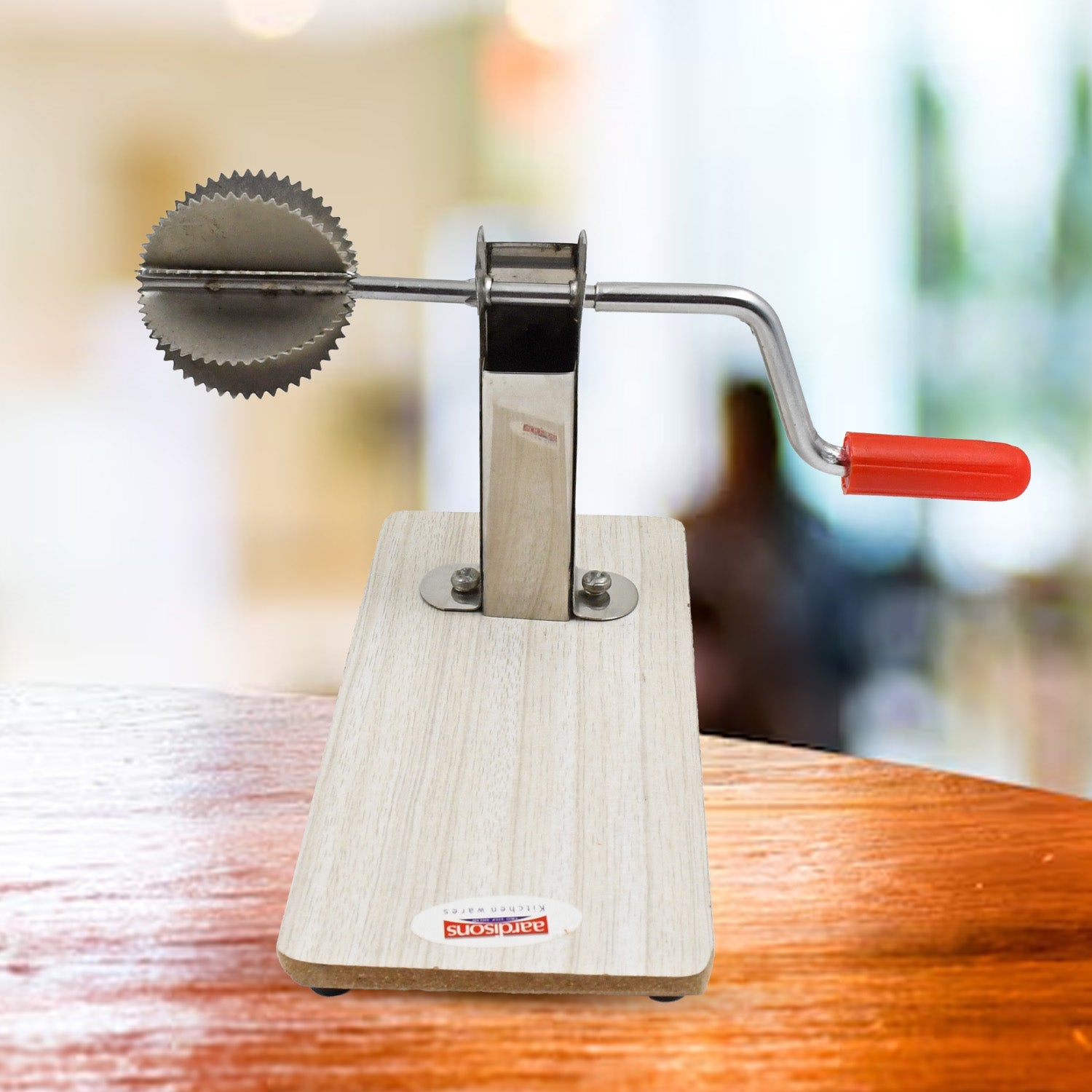 The sleek, shiny stainless steel components of the Quickslice coconut scraper.