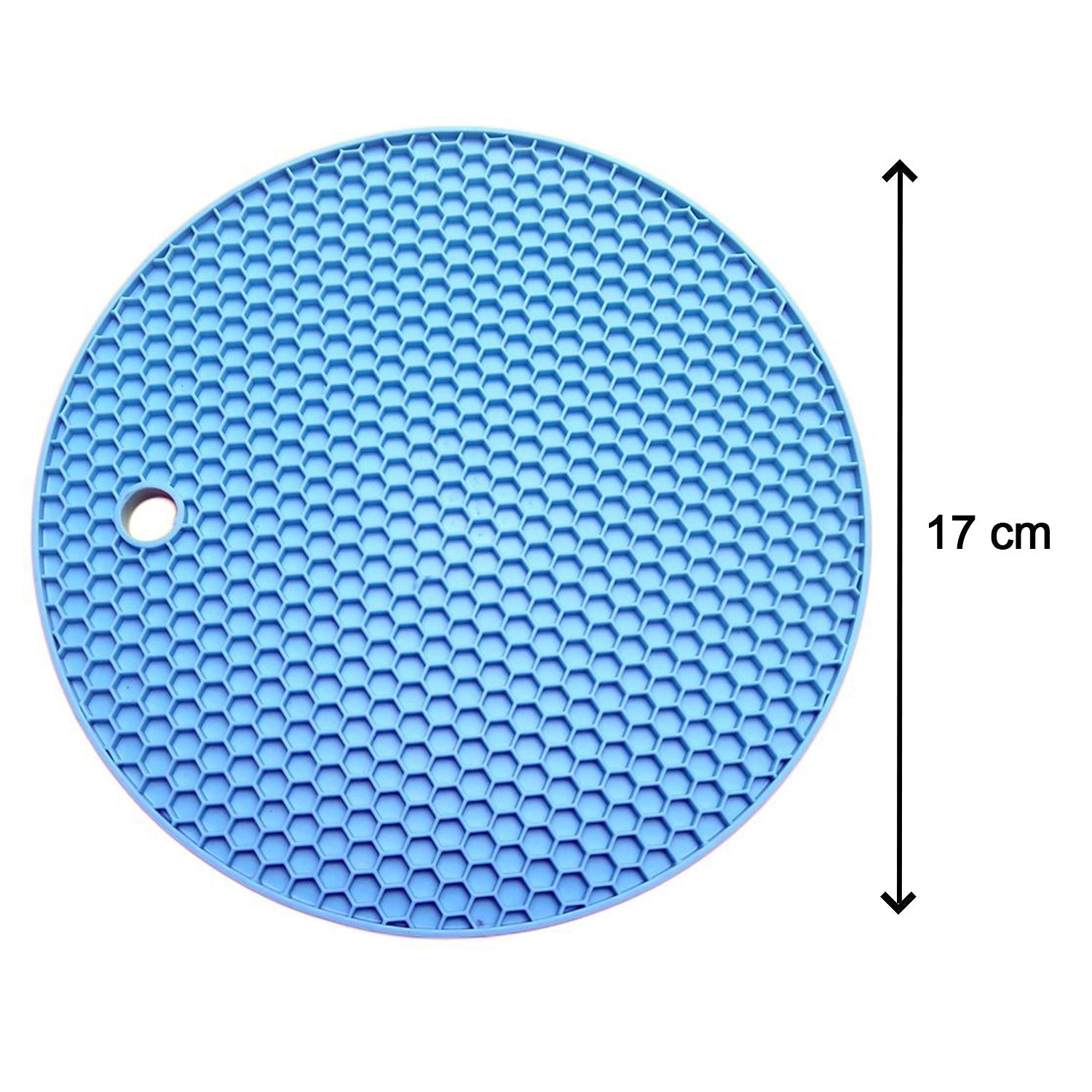Flexible silicone hot mat being used to serve hot dishes on a dining table.