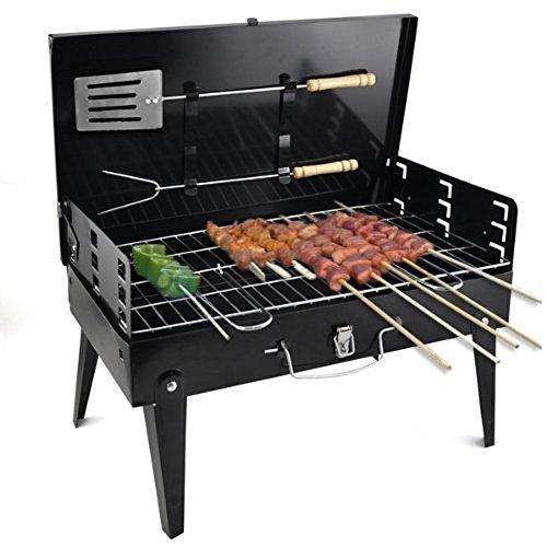 Compact charcoal grill set up for an outdoor picnic, perfect for small gatherings.