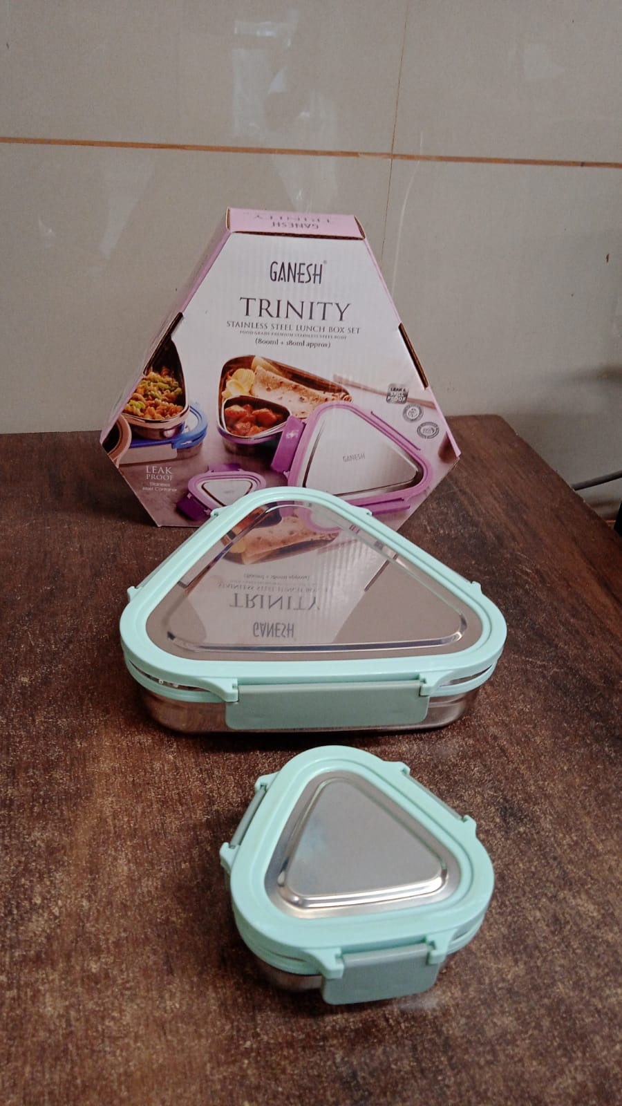 Ganesh Trinity lunch box set packaging showing compact triangle design