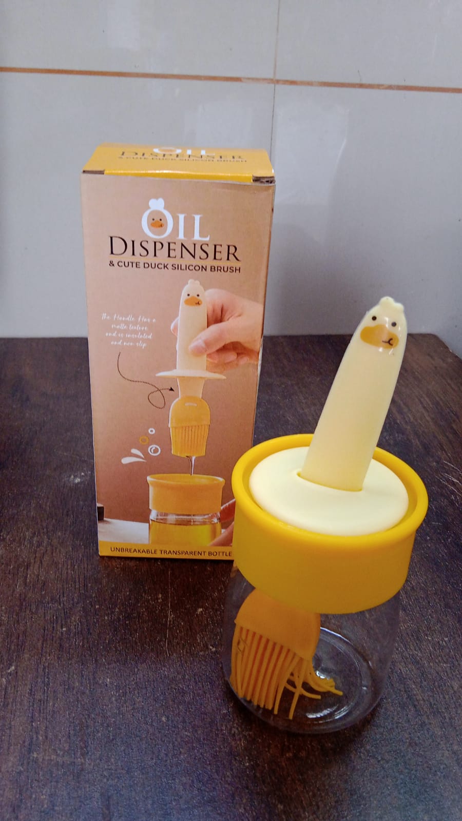 An alternative angle of the versatile oil dispenser bottle, ready for use in the kitchen.