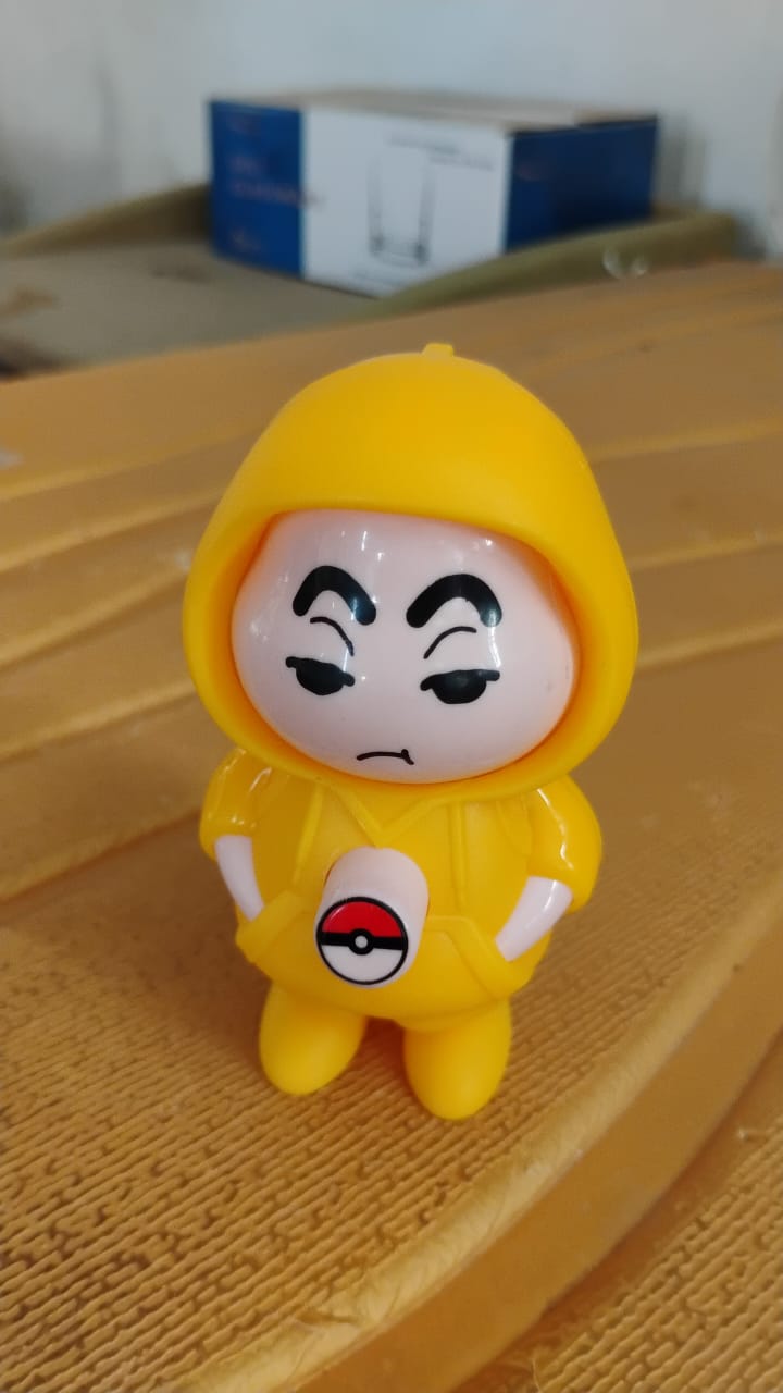 Side view of a Face Changing Keychain, demonstrating its unique design and keyring attachment.
