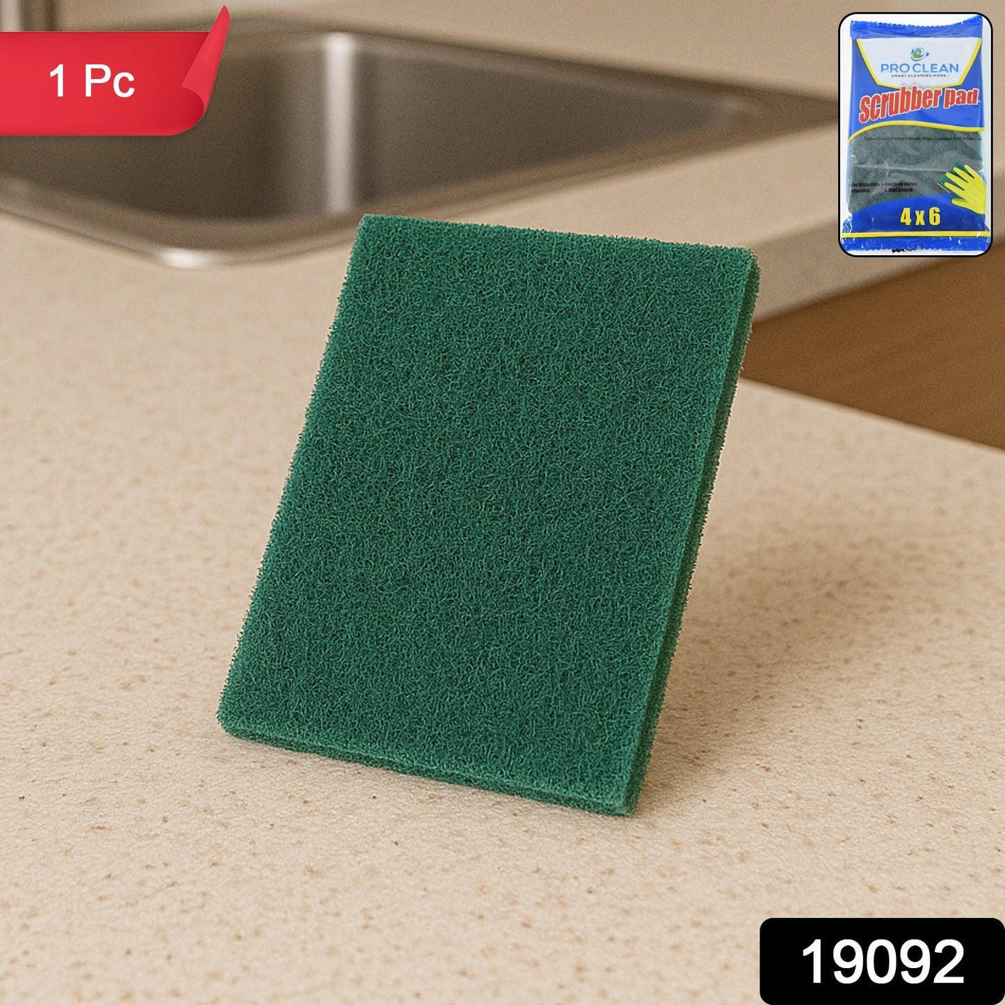 Green multipurpose kitchen scrubber pad removing grime on utensils