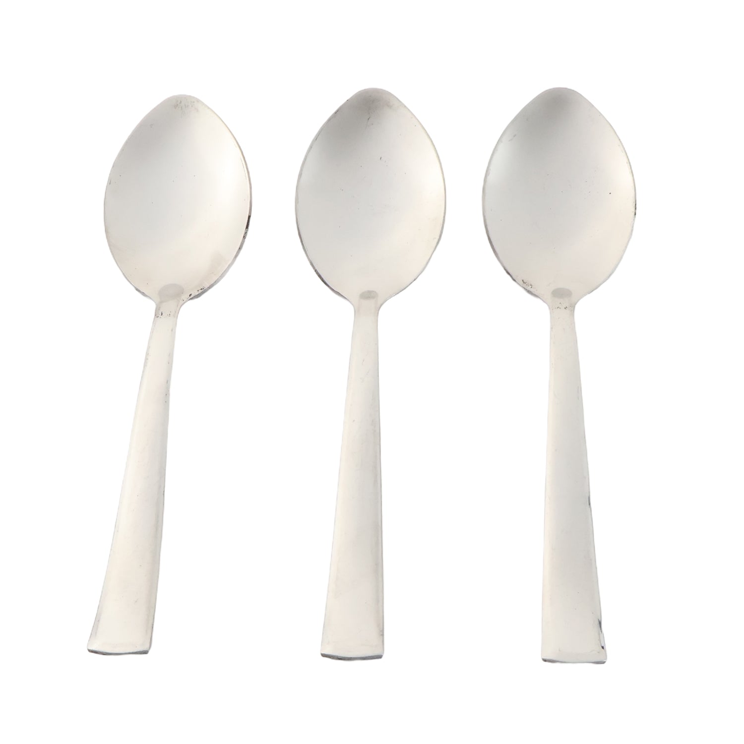 Three stainless steel dining spoons arranged side by side for tableware