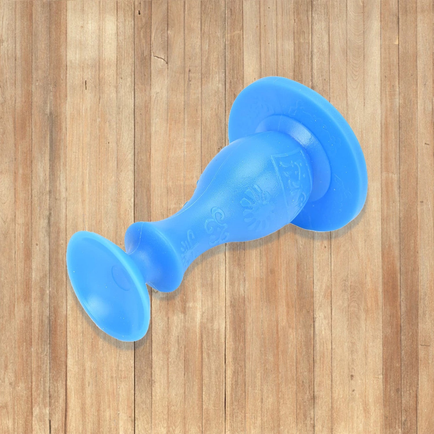 Versatile washer door stopper also functioning as a prop for a room door.