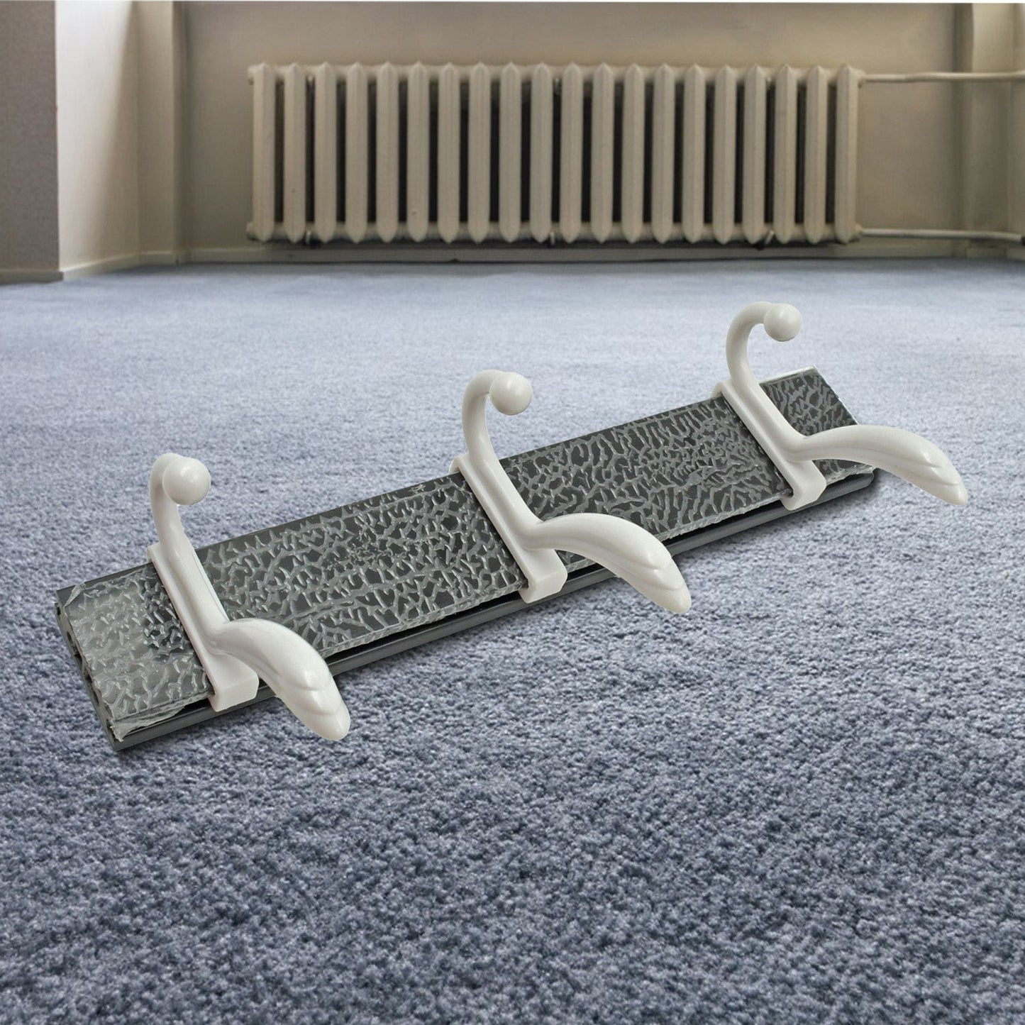 Minimalist GlimmerHome wall mounted coat rack holding a dog leash and jackets