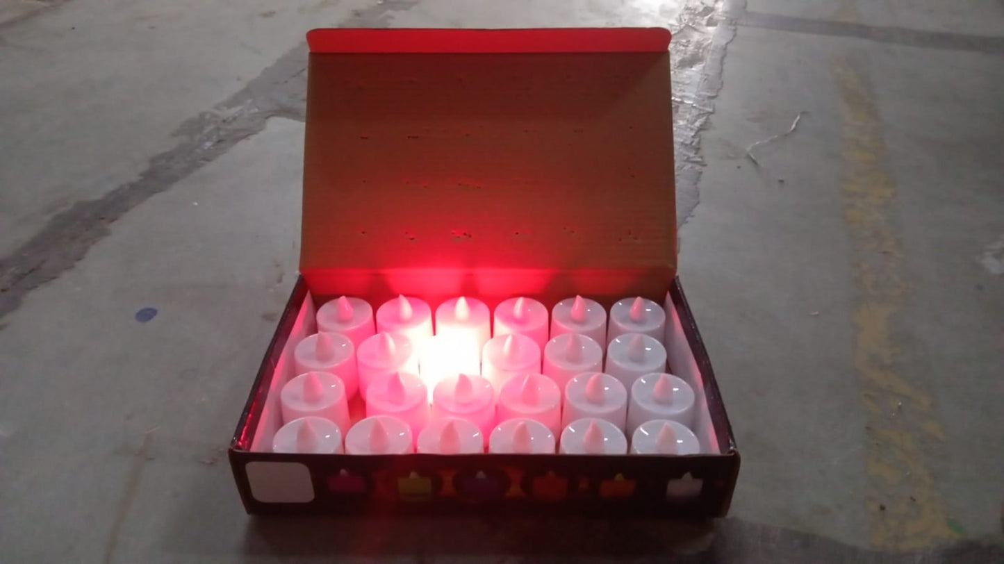 Red LED flameless tealight candles glowing softly on a decorative surface