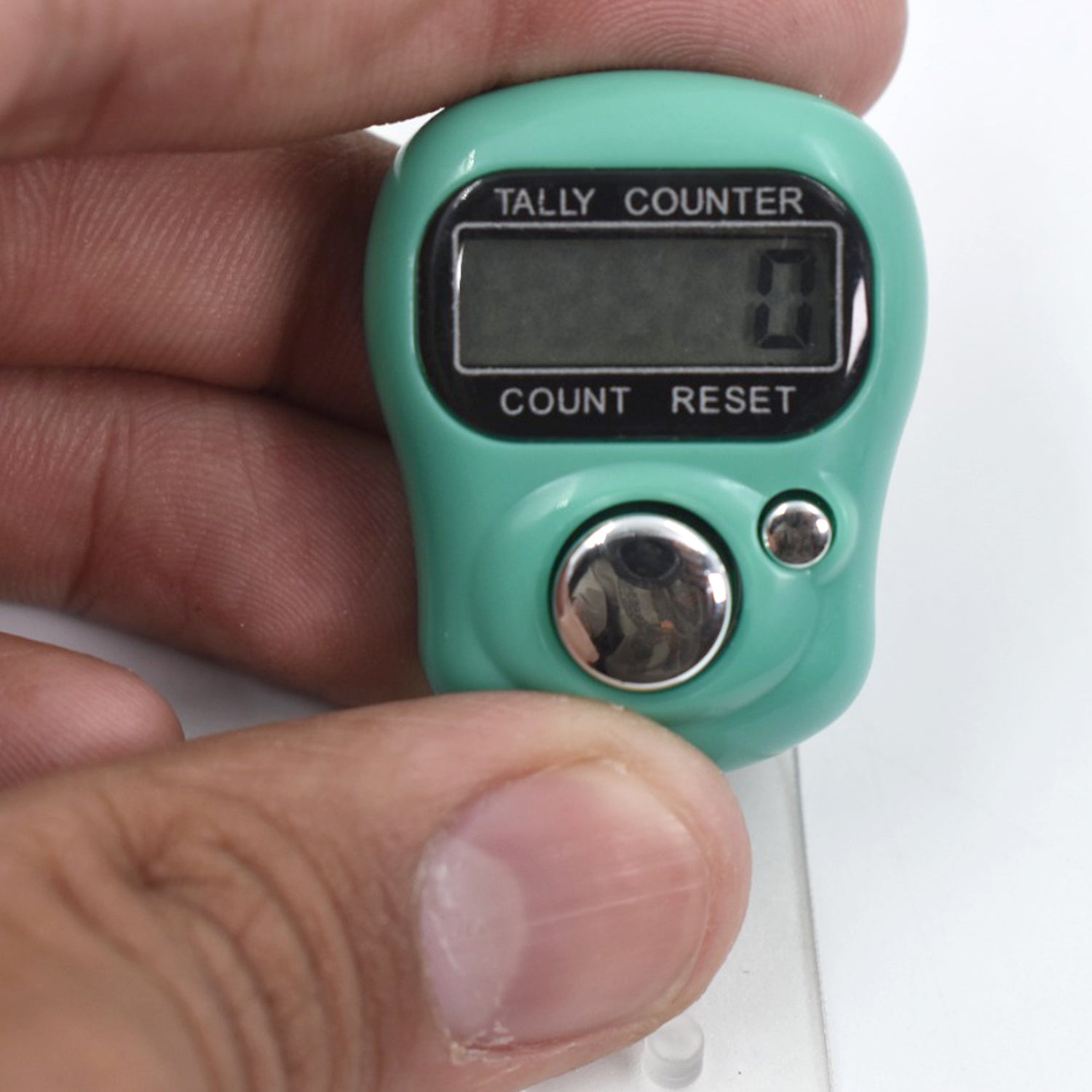 Side view of the portable manual hand counter designed for comfortable grip.