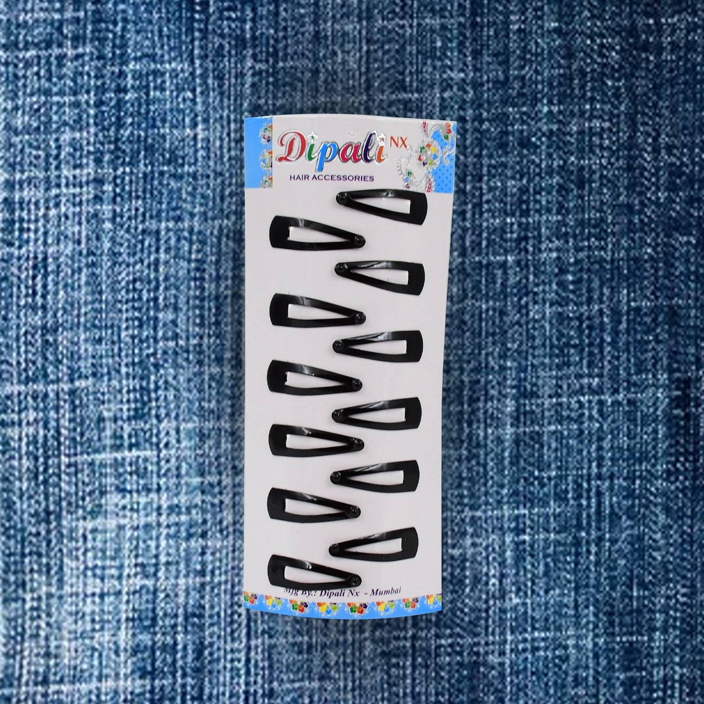 A single matt black Metal Tic Tac Hair Clip demonstrating its strong, flexible mechanism.