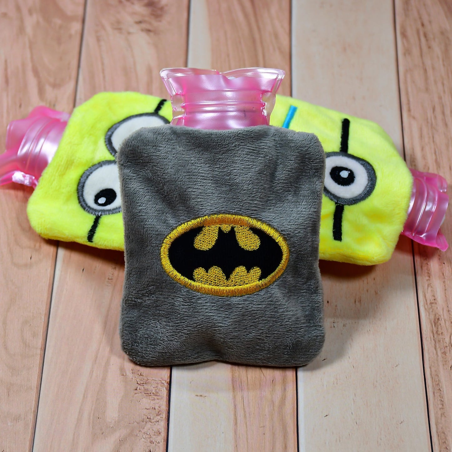 Batman Hot Water Bag shown for targeted neck and shoulder pain relief.