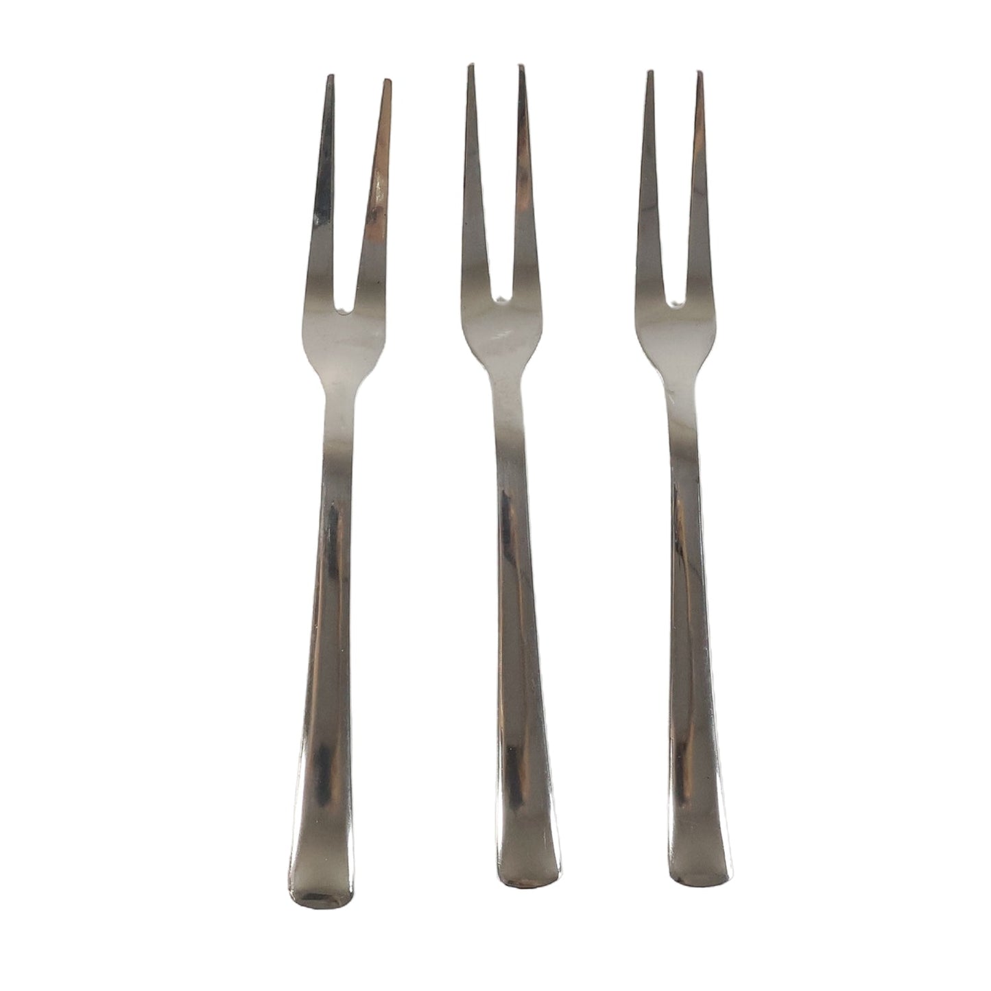 Three small appetizer forks laid out for serving snacks