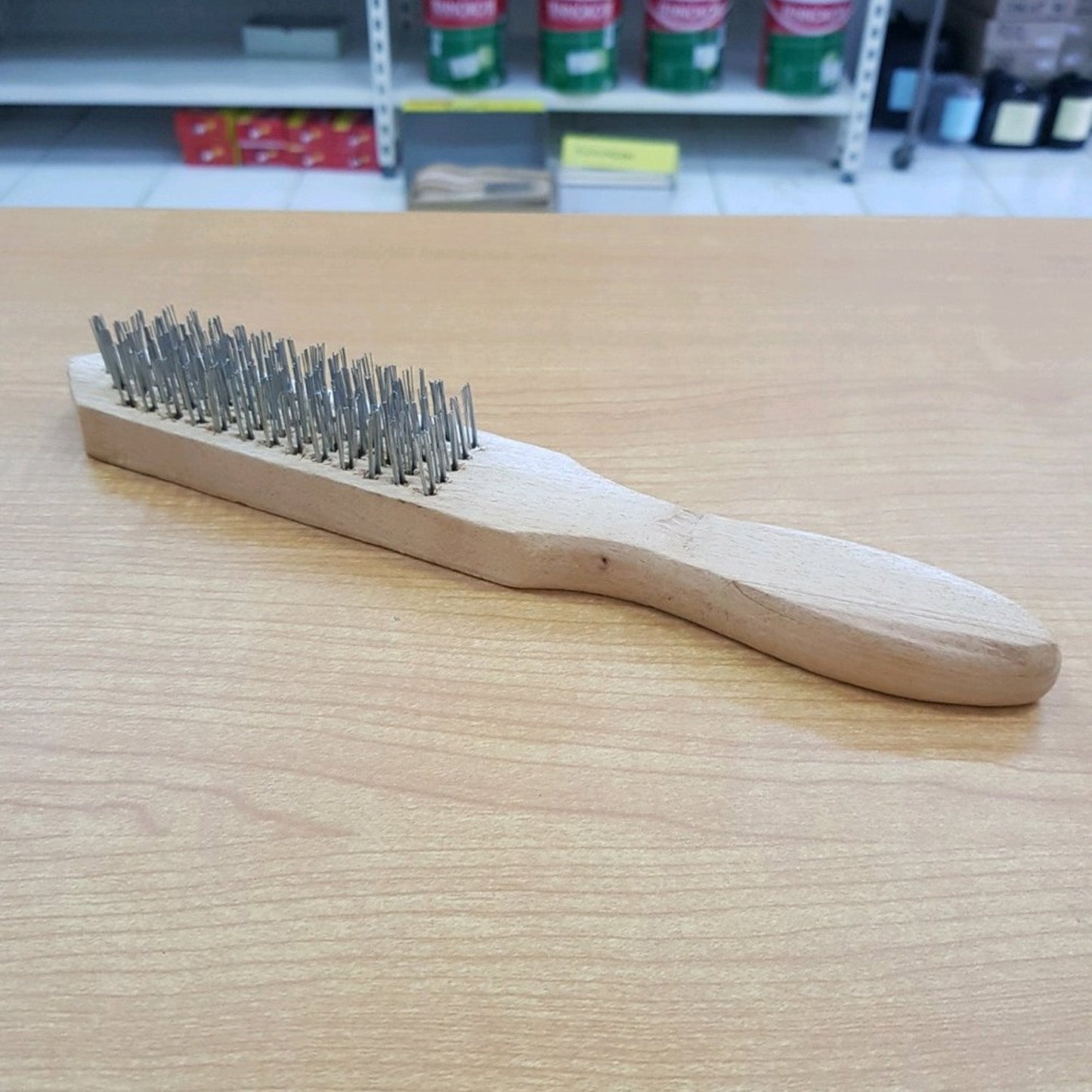 Angled view showcasing the robust stainless steel wires of the brush.