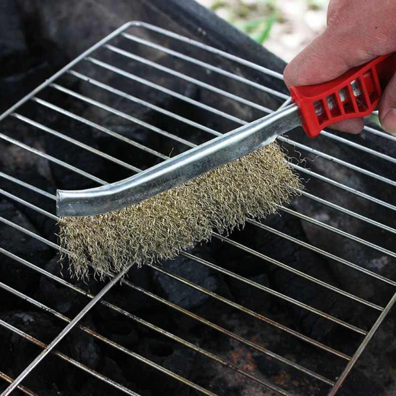 Stainless steel wire brush with ergonomic handle, ideal for rust removal.