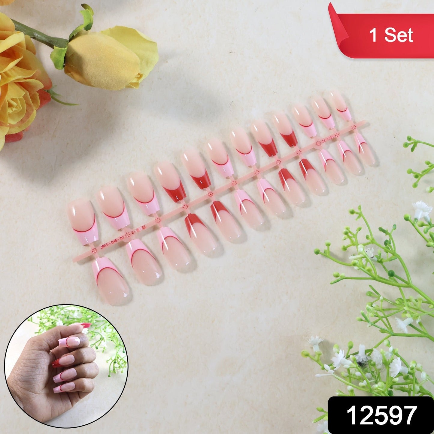 Close-up of artificial nail tips showing glossy French tip design