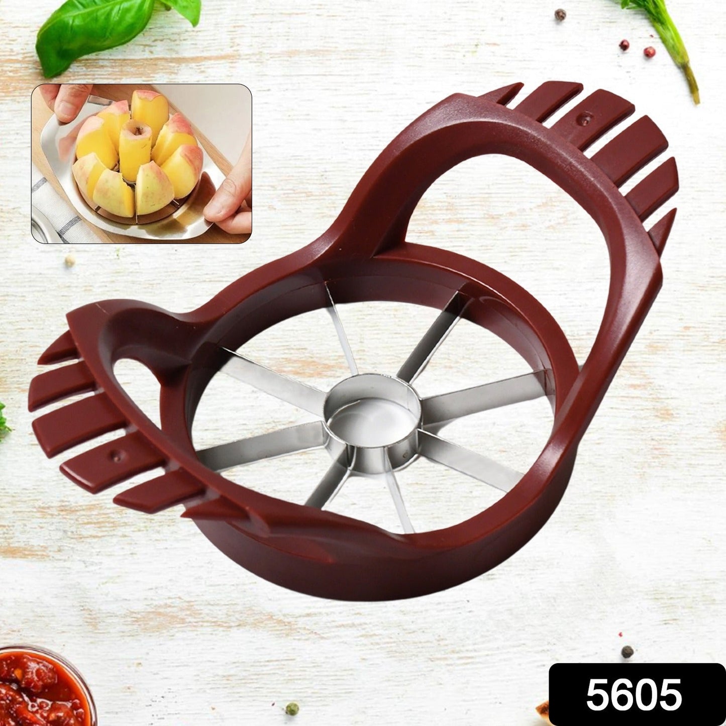 A whole red apple positioned below the stainless steel fruit slicer, ready for cutting.