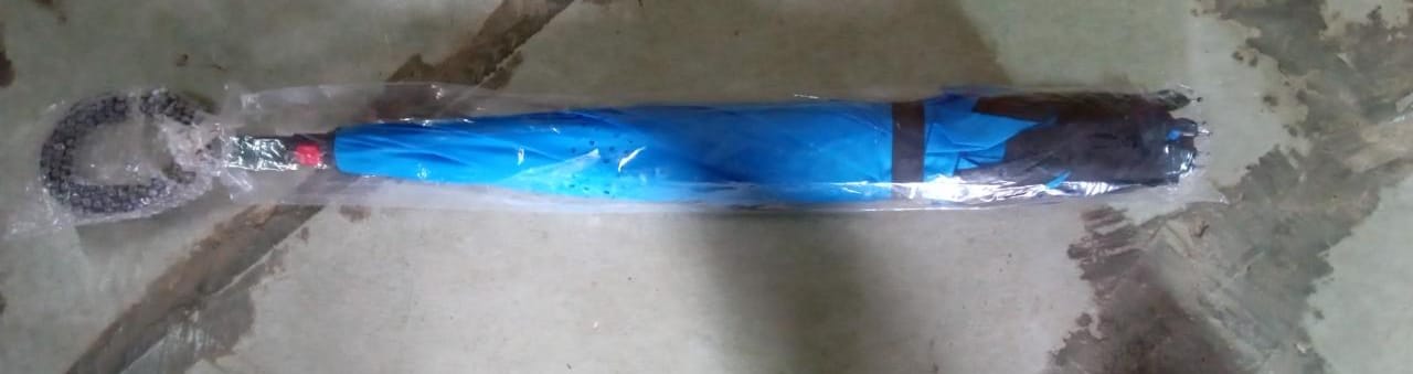 Practical reverse umbrella in use during wet conditions, keeping you dry.