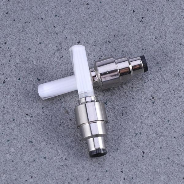 A pair of sleek silver LED tyre valve caps with internal mixed-color lights.